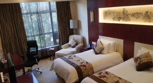 Katil atau katil-katil dalam bilik di New Century Hotel Zaozhuang Fengming