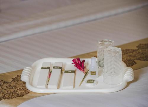 Кровать или кровати в номере Vy Chhe Hotel