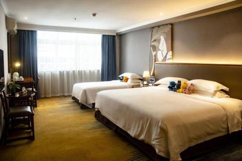 Ένα ή περισσότερα κρεβάτια σε δωμάτιο στο Uniton Hotel Shenzhen