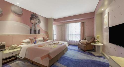 a bedroom with a large bed and a flat screen tv at Hohhot Hai Liang Plaza Hotel in Hohhot