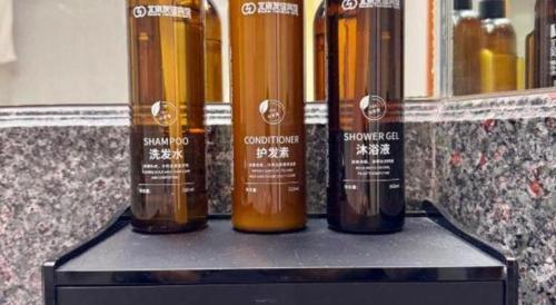 a row of bottles of wine sitting on a shelf at Beijing Friendship Hotel Jing Bin Building in Beijing