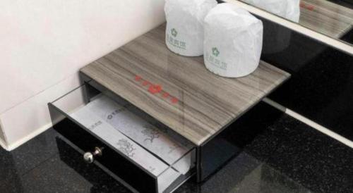 two rolls of toilet paper sitting on a table at Movie Star Hotel in Guangzhou