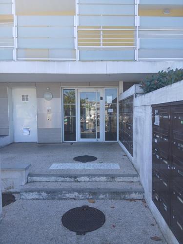 a building with a staircase leading up to a building at Toulouse Coconing & Peaceful Apartment in Toulouse