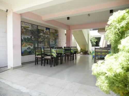 a patio with tables and chairs on a building at Ocean View tourist guest house at Negombo beach near the airport in Negombo