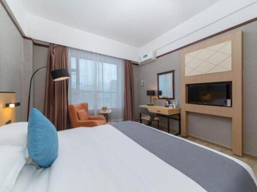 Katil atau katil-katil dalam bilik di GreenTree Inn Zhongshan Nanlang Metro Station Branch
