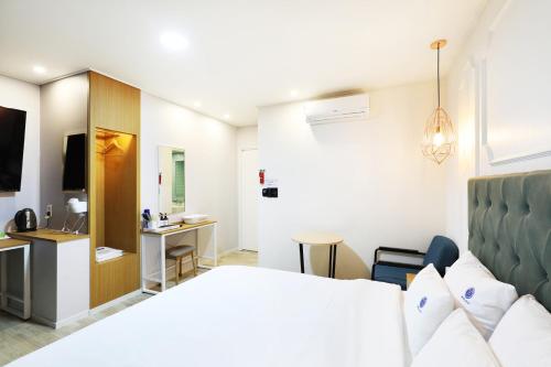 Postel nebo postele na pokoji v ubytování Hotel Ryan
