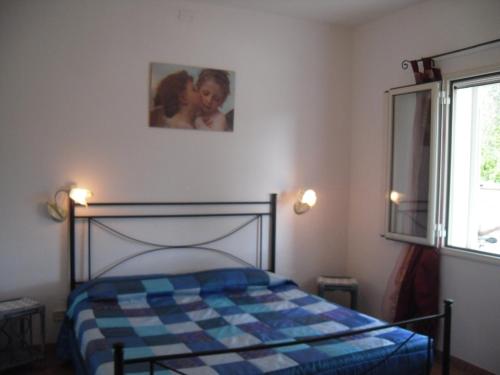 Voodi või voodid majutusasutuse Appartamento MareMontagna toas