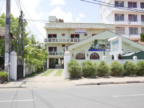 a building on the side of a street at Ocean View tourist guest house at Negombo beach near the airport in Negombo