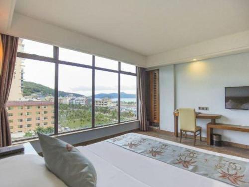 Postel nebo postele na pokoji v ubytování Galaxy Bay Resort