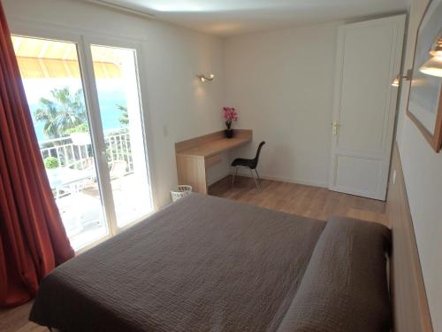 Ένα ή περισσότερα κρεβάτια σε δωμάτιο στο Residence Veles Plage