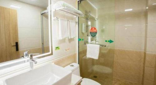 a bathroom with a sink and a toilet and a shower at GreenTree Inn Hefei Chenghuangmiao San Xiao Kou Subway Station Hotel in Hefei