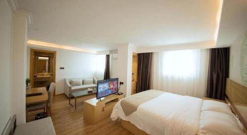 Ένα ή περισσότερα κρεβάτια σε δωμάτιο στο GreenTree Inn Qingyuan Qinghe Avenue Branch
