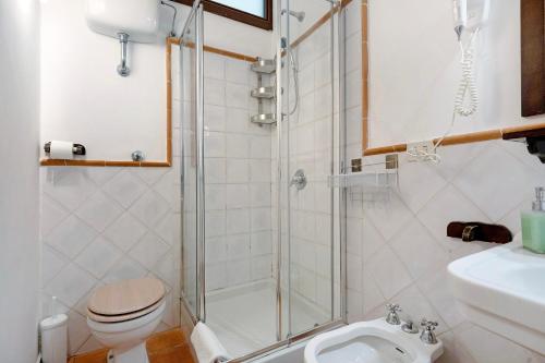 a bathroom with a shower and a toilet and a sink at Agriturismo Barone Antonio Negri in Fisciano