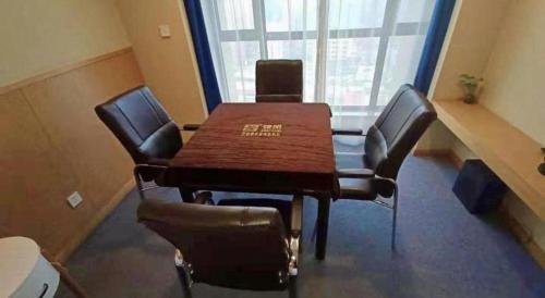 a conference room with a wooden table and chairs at Kyriad Marvelous Hotel·Xi'an North High-speed Railway Station in Xi'an