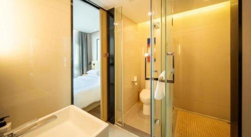 Koupelna v ubytování Echarm Hotel Yangjiang Baili Plaza