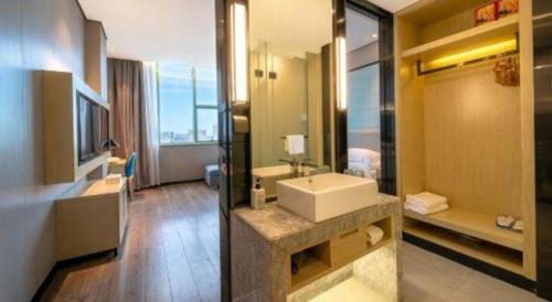 Koupelna v ubytování Echarm Hotel Yangjiang Baili Plaza