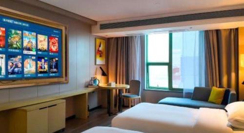 Postel nebo postele na pokoji v ubytování Echarm Hotel Yangjiang Baili Plaza