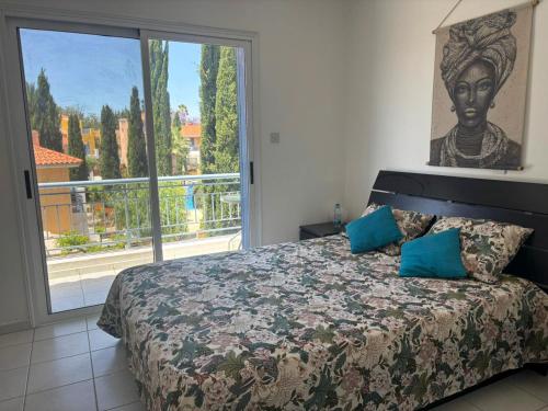 a bedroom with a bed and a large window at Viktoria Houses Anarita in Anarita