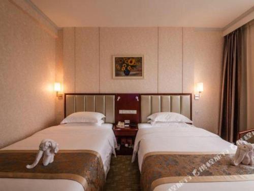 Cama o camas de una habitación en Nanning Yongzhou Hotel