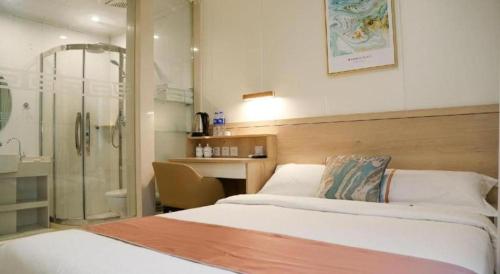 a hotel room with two beds and a shower at Beijing Inner Mongolia Hotel Chaoyang in Beijing