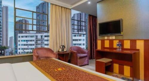 a hotel room with a bed and a large window at Super 8 Hotel Shiyan Beijing Middle Road in Shiyan