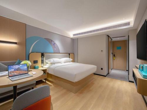 Postel nebo postele na pokoji v ubytování City Comfort Inn Wuhan Jiangxia