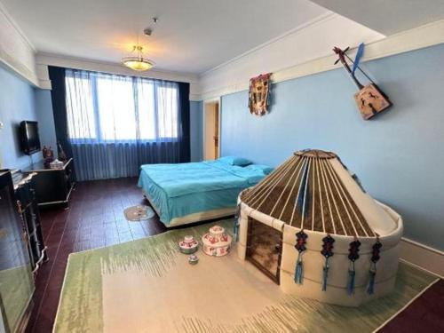 a bedroom with a bed in a room at Hohhot Inner Mongolia Hotel in Hohhot