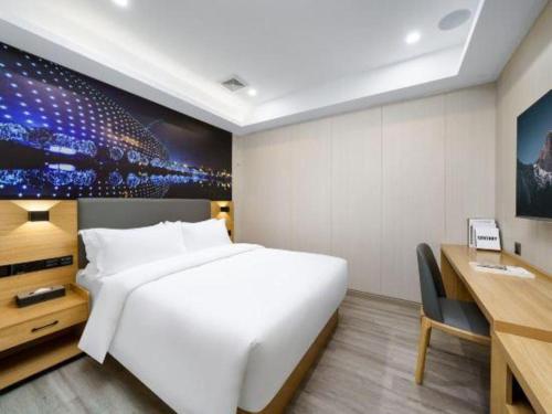 Cama o camas de una habitación en Sheng Lin Na Hotel Minzhi Branch