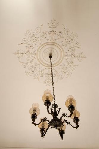 a chandelier hanging from a ceiling at Hotel Biscari in Catania