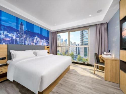 Cama o camas de una habitación en Sheng Lin Na Hotel Minzhi Branch