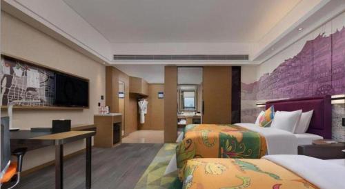 Postel nebo postele na pokoji v ubytování Hampton By Hilton ChangSha XingSha