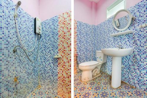 Koupelna v ubytování OYO 749 Baan Suan Resort