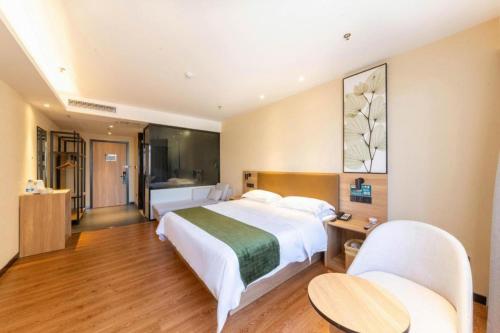 Ένα ή περισσότερα κρεβάτια σε δωμάτιο στο GreenTree Inn Lu'an Jin'an District Yuanda Xingfuli