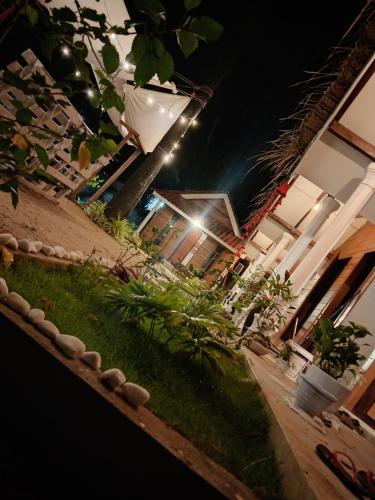 a room with a table with plants and lights at Bliss Cabana in Trincomalee