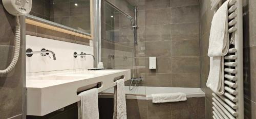 Koupelna v ubytování Hotel Les 3 Cles