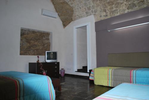 TV a/nebo společenská místnost v ubytování Casa Vacanze A Truatura