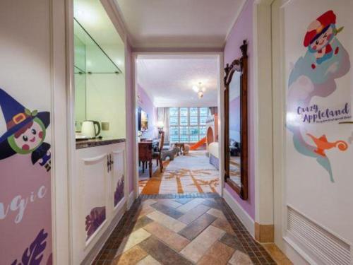 a hallway with a room with a kitchen and a dining room at Hangzhou The First World Hotel in Hangzhou