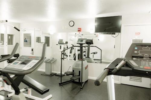 a hospital room with machines and a tv at Quality Inn & Suites Lathrop in Lathrop