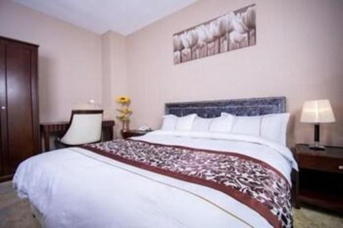 Postel nebo postele na pokoji v ubytování Mika Hotel