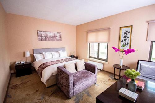 Postel nebo postele na pokoji v ubytování Mika Hotel
