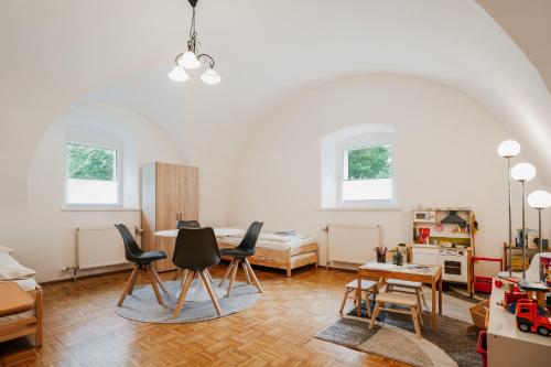 a living room with chairs and a table at NaturparkResort Almmauer in Landl