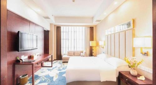 Postel nebo postele na pokoji v ubytování Inzone Garlnd Hotel Zhangqiu