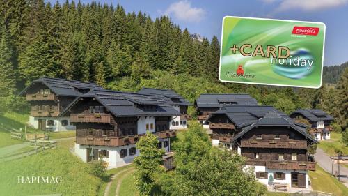 a rendering of a house with black roof at Hapimag Ferienwohnungen Sonnleitn in Sonnenalpe Nassfeld