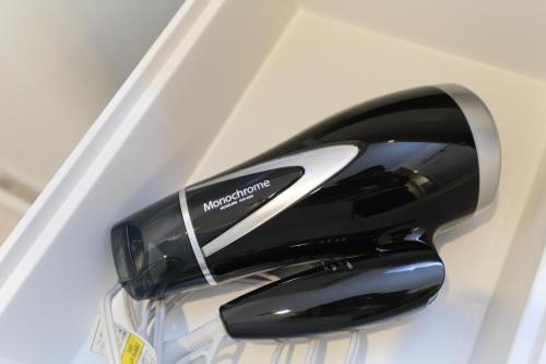 a black and white toaster sitting in a drawer at Cure Skytree in Tokyo