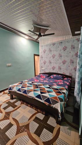 a bedroom with a bed and a chair in it at Sanjeevani homestay,kashid in Kashid