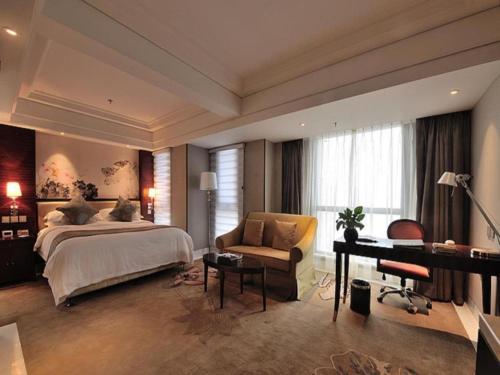 Postel nebo postele na pokoji v ubytování China Palace Hotel