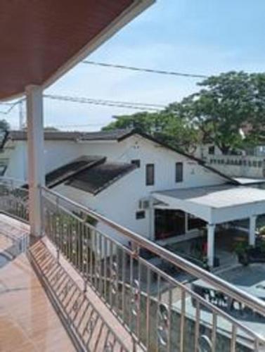 a balcony of a house with a building at Baltis Inn 3 Banyumanik in Semarang