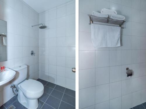 two pictures of a bathroom with a toilet and a sink at Capital O 89538 Ocean Hotel in Labuan