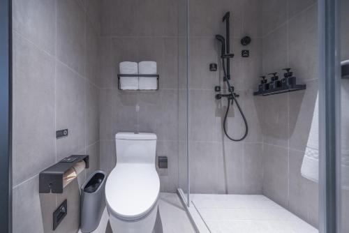 a bathroom with a toilet and a shower at Atour Light Hotel Beijing West Railway Station Liuliqiao Subway Station in Beijing