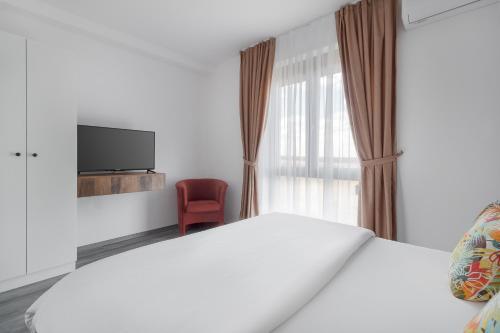 Ένα ή περισσότερα κρεβάτια σε δωμάτιο στο Golden Hour Apartment